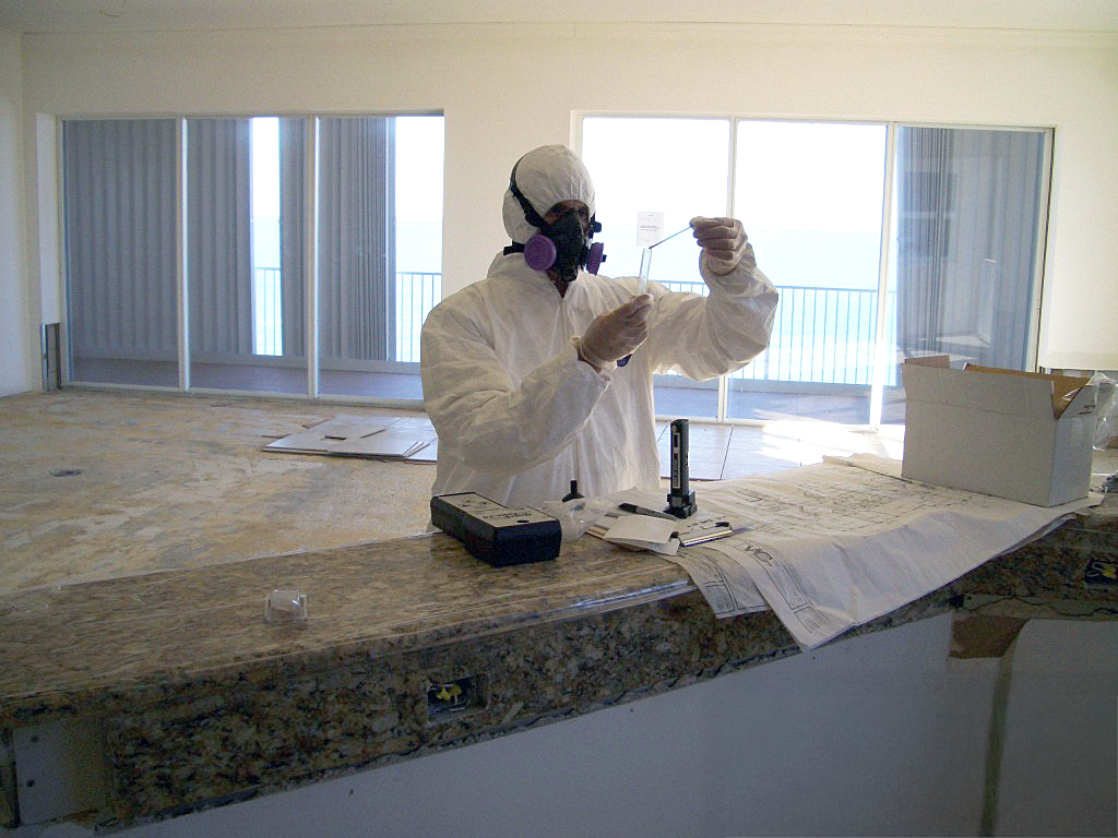 A BMC Technician Conducts A Mold Analysis With A Field Test Kit On Location.