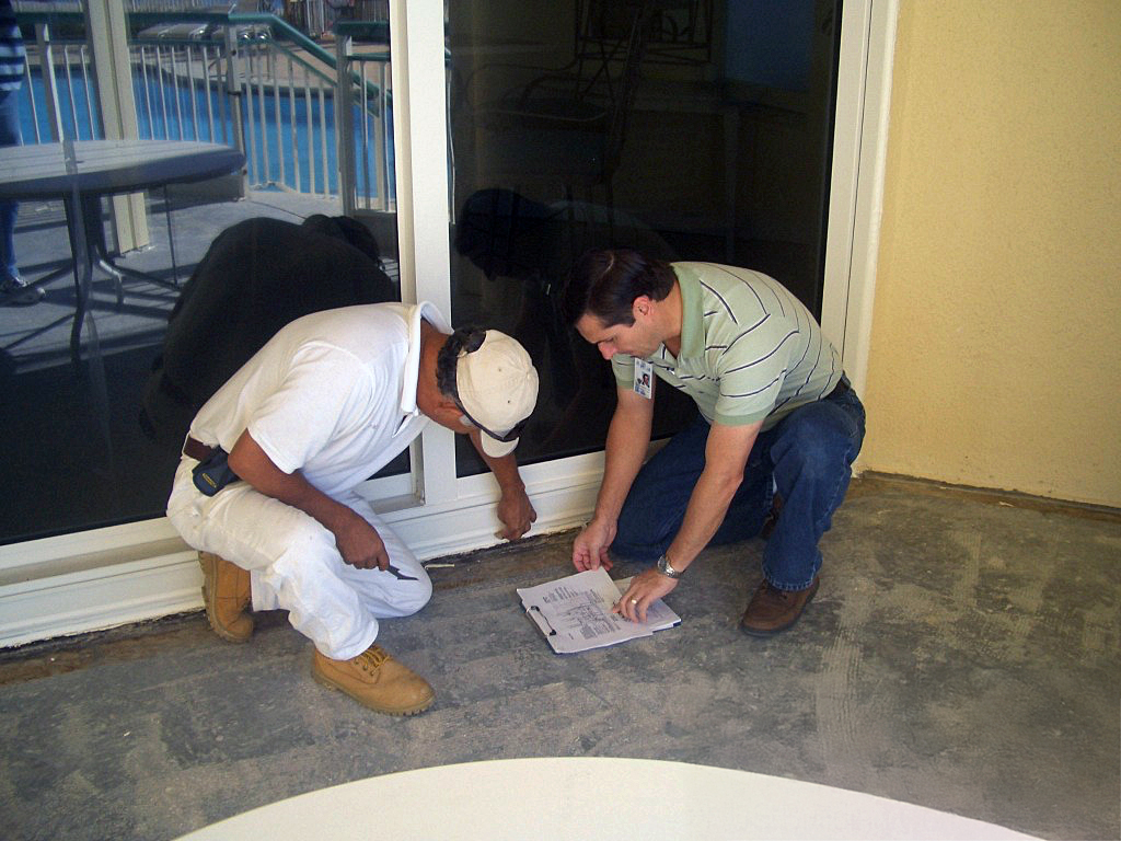 BMC Technicians Analyze Moisture Intrusion And Water Leak Patterns In Field.