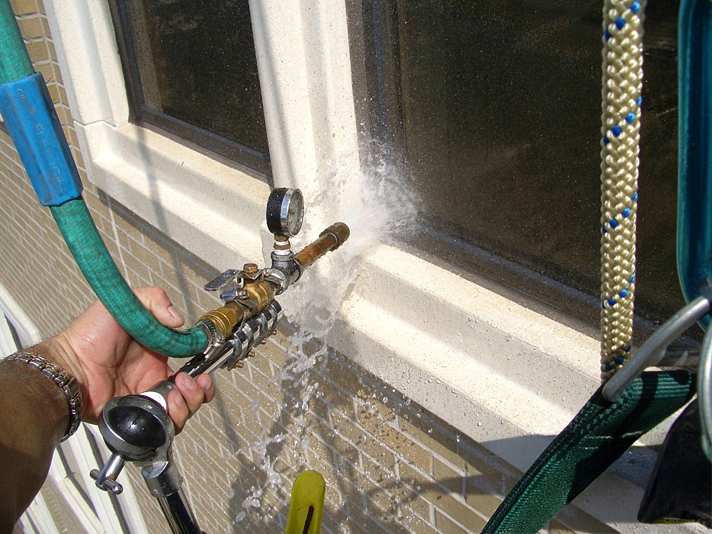 A BMC Technician Conducting Moisture Analysis and Water Intrusion Analysis In The Field.